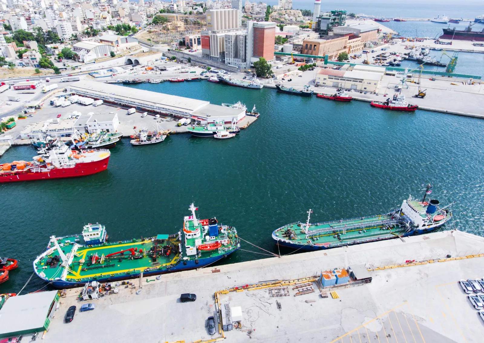 Commercial vessels in Piraeus supported by international crew supply operations